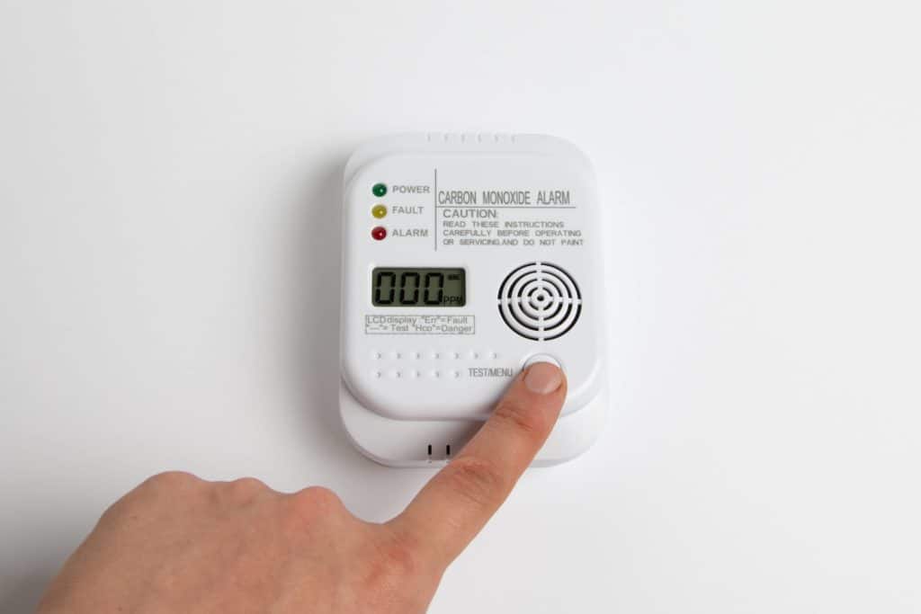 A carbon monoxide detector can detect the gas in the home and opening a window does not fix it.