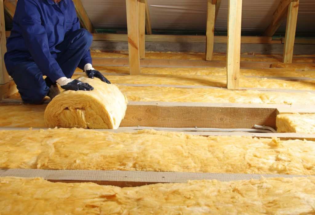 Fiberglass Insulation is nonflammable and rolls over electrical wiring in attic.