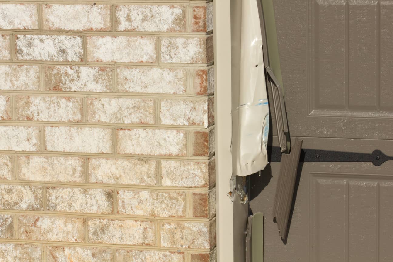 Damaged garage door.