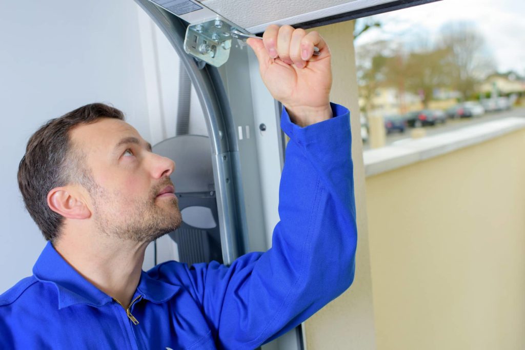 Garage door repairman is needed to fix issues.