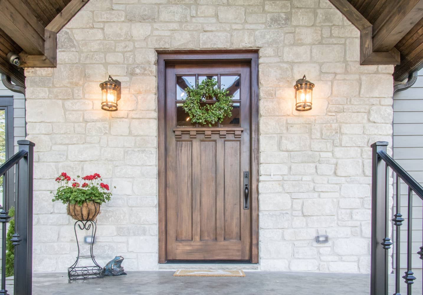 New light fixtures on a new stone home.