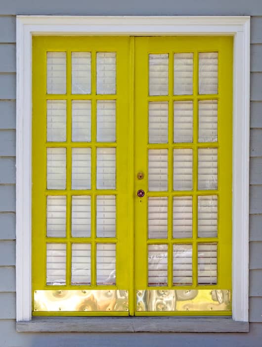 French doors with metal kick plates.